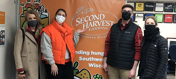 Rhyme Staff volunteering at Second Harvest