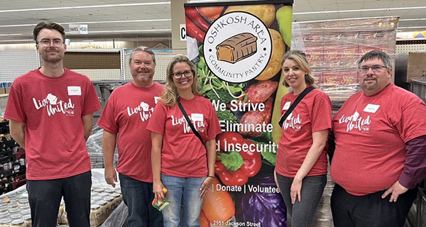 Group of Rhyme Staff volunteering at the Oshkosh area community pantry.