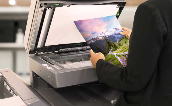 Office worker making color copies on BP Series MFP