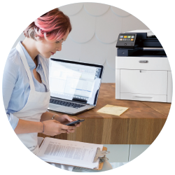 Woman Sitting by Computer Working