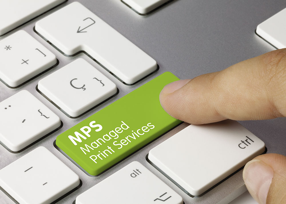 Finger pointing to a keyboard key with MPS Managed Print Services on it surrounded by white keyboard keys